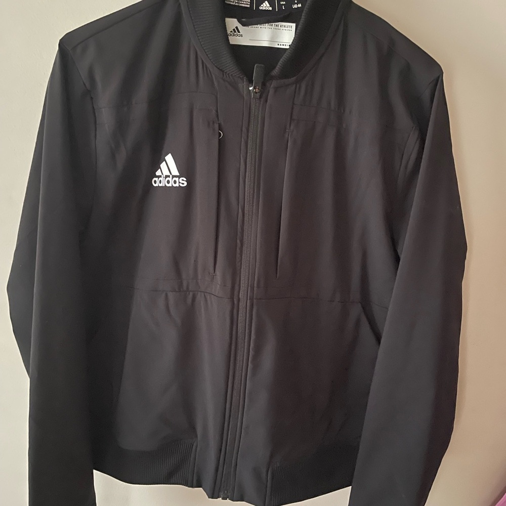 Women’s Black Adidas Zip windbreaker size large.  Excellent condition.